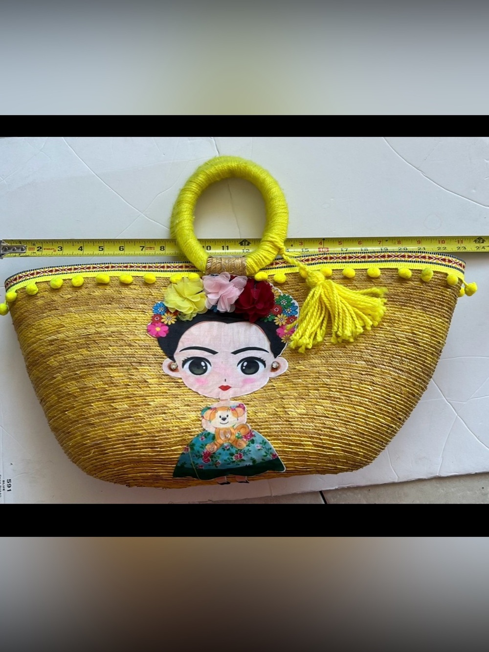 Yellow woman’s Straw Tote Bag with Decorative Frida Doll Accent